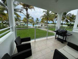 a balcony with a piano and a view of the ocean at Playa Blanca Beach Rentals in Playa Blanca
