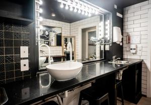 a bathroom with a sink and a large mirror at BeHome in Gold Coast +13 photos