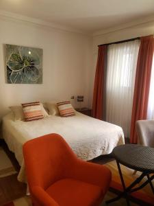 Cama ou camas em um quarto em Hostal Boutique Casa La Barca