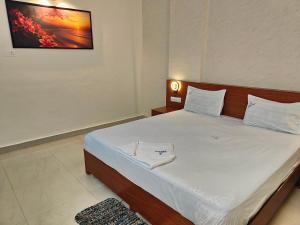 Postel nebo postele na pokoji v ubytování Hotel Geetha International