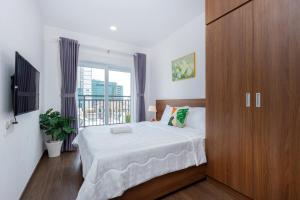 Postel nebo postele na pokoji v ubytování Mermaid seaview Vung Tau- Ruby homestay