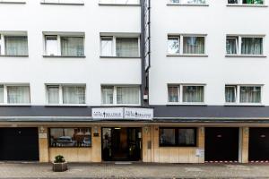a building with the front entrance to the hazelhurst hotel at Bellevue Hotel in Düsseldorf +24 photos