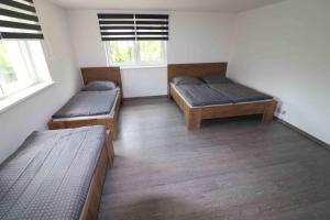 Posteľ alebo postele v izbe v ubytovaní Apartmán u Trojmezí