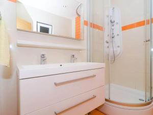 a bathroom with a sink and a shower at Apartments Villa Bella Vista - Two Bedroom Apartment with Balcony and Sea View in Potomje +19 photos