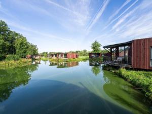 a view of a river with houses on it at Sky Pad Lakeside Stay in Antoing