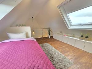 Postel nebo postele na pokoji v ubytování Ferienhaus Zuhause am Deich