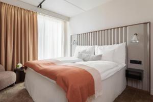 Letto o letti in una camera di Clarion Hotel Karlatornet