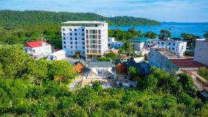 an aerial view of a city with the ocean at Antus Homestay in Quang Ninh
