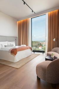 Postel nebo postele na pokoji v ubytování Clarion Hotel Karlatornet + 37 fotografií