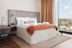 Letto o letti in una camera di Clarion Hotel Karlatornet