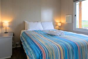 Postel nebo postele na pokoji v ubytování Lang Lang Caravan Park