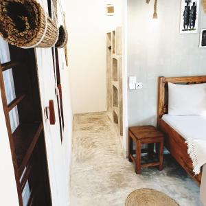 Postel nebo postele na pokoji v ubytování Michamvi Spirit Lodge