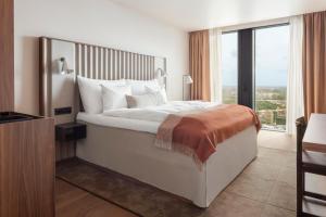 Letto o letti in una camera di Clarion Hotel Karlatornet