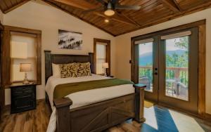 a bedroom with a bed and a window at Smoky Mountain Skies in Gatlinburg +60 photos