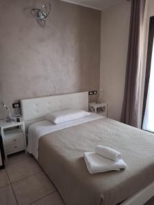 Postel nebo postele na pokoji v ubytování B&B Da Rocco