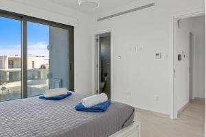 Postel nebo postele na pokoji v ubytování Serenity Waves Villa 12 + 20 fotografií