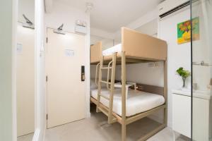 Uma cama ou camas num quarto em Apple lnn Causeway Bay