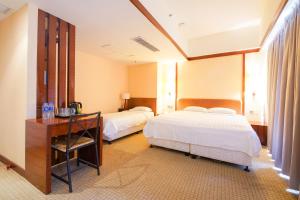 Letto o letti in una camera di Warwick Hotel Cheung Chau