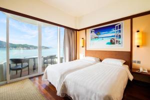 Letto o letti in una camera di Warwick Hotel Cheung Chau