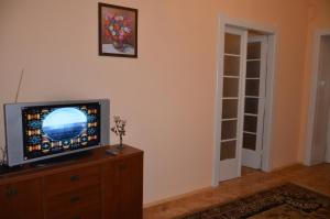 a television sitting on a dresser in a room at Apartment Viatores in Lviv