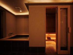 a bathroom with a sink and a bath tub at THE SENSE HOTEL TOKYO in Tokyo +16 photos