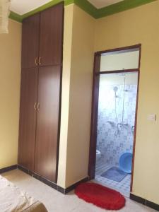 Postel nebo postele na pokoji v ubytování Palm Suites