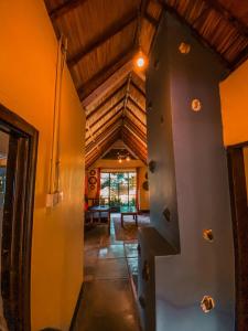 an attic hallway of a house with a wooden ceiling at Sipi Falls Lodge in Sipi