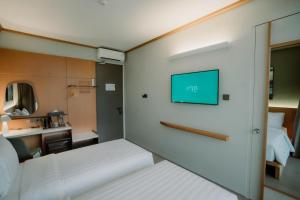 Voodi või voodid majutusasutuse Jiro Hotel toas