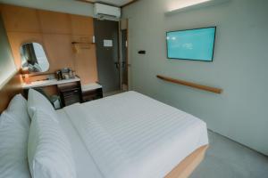 Voodi või voodid majutusasutuse Jiro Hotel toas