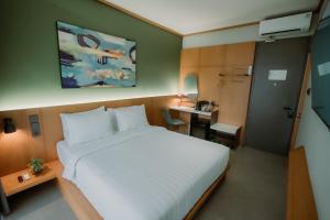 Voodi või voodid majutusasutuse Jiro Hotel toas