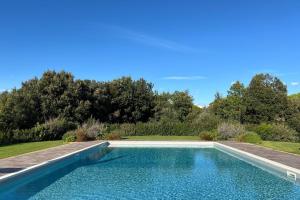a swimming pool in the middle of a yard at Gorgeous Villa Peccioli, with private pool, AC, Wifi in Legoli +78 photos