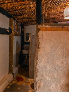 a small room with a sink and a wall at Sipi Falls Lodge in Sipi