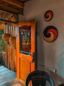 a door to a room with aiki at Sipi Falls Lodge in Sipi