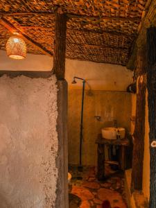 a bathroom with a sink in a room at Sipi Falls Lodge in Sipi