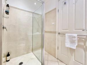 a shower with a glass door in a bathroom at Rocky Mountain Cottage in Blackheath +96 photos