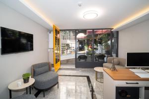 an office with a desk and chairs and a computer at Robin Hotel in Istanbul