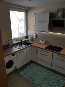 Kuchyňa alebo kuchynka v ubytovaní Oli apartments Telgárt