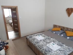 Posteľ alebo postele v izbe v ubytovaní Oli apartments Telgárt
