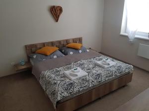 Posteľ alebo postele v izbe v ubytovaní Oli apartments Telgárt