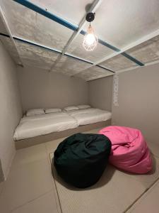 Postel nebo postele na pokoji v ubytování Qowiy Village Langat