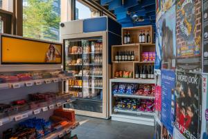 a store filled with lots of drinks and alcohol at MEININGER Hotel Amsterdam City West in Amsterdam