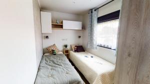 Posteľ alebo postele v izbe v ubytovaní Camping Officiel Siblu Les Oyats