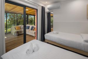 Posteľ alebo postele v izbe v ubytovaní Camping Homes Mon Perin