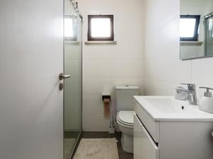 a bathroom with a toilet and a sink at Regatta - Beachfront and Sea Views in Ponta Delgada +17 photos