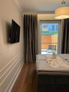 Μια τηλεόραση ή/και κέντρο ψυχαγωγίας στο LTS RENT Luxury & Comfortable Villa Angielska Grobla