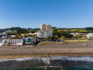 a view of a beach with people on the sand at Regatta - Beachfront and Sea Views in Ponta Delgada