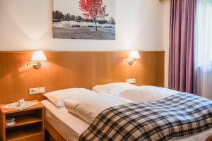 Postel nebo postele na pokoji v ubytování Residence Erika - Apartments, Breakfast & Sauna
