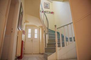a staircase in a house with a stair case at Archontiko Eleni Hotel in Andros