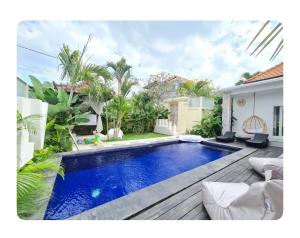 a swimming pool in the backyard of a house at Cozzy room in heart of Canggu#1 in Canggu