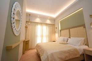 Postel nebo postele na pokoji v ubytování Elena Village Hotel & Suites